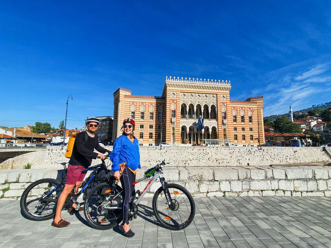 Cyclists riding through Sarajevo on the city bike tour
